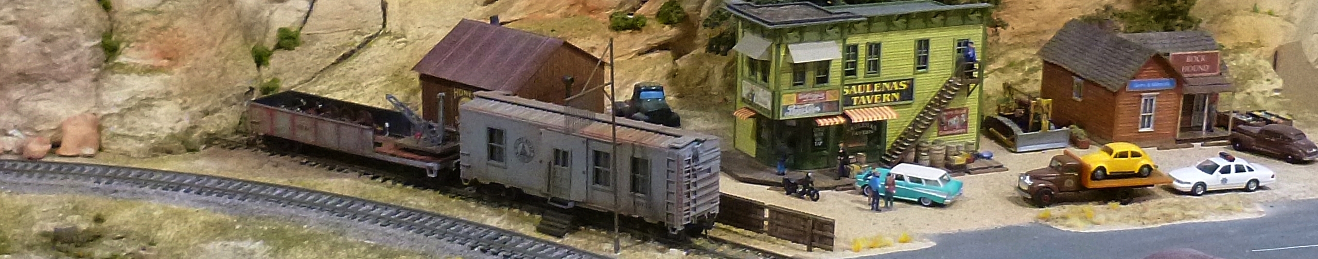 A worktrain parked on a new siding, the crew obviously enjoying a few in the tavern.