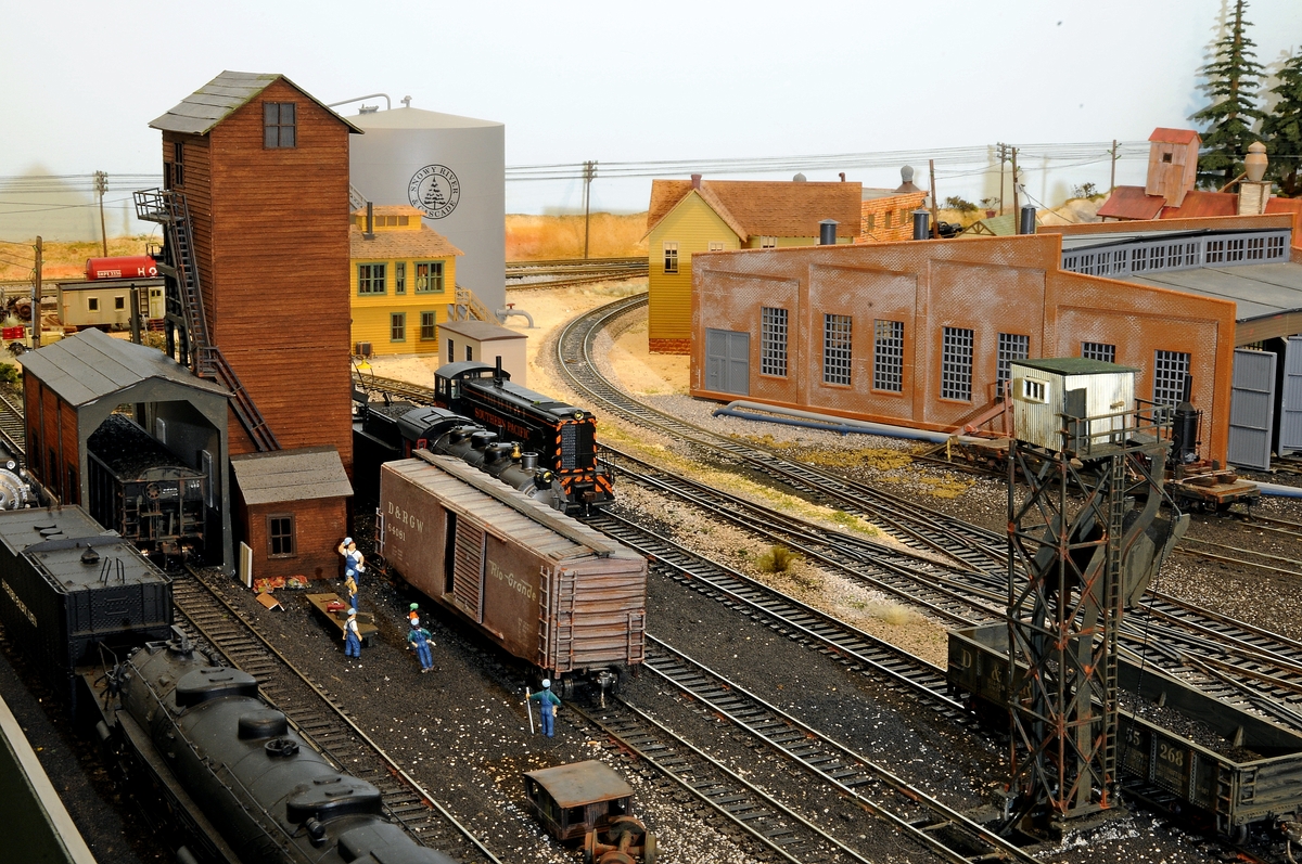 Crew working on a Rio Grande boxcar on the RIP Track.